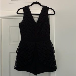 black mini jumpsuit with lace detailing
